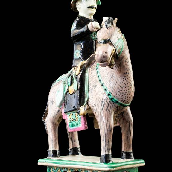 GG: Chinese biscuit porcelain model of a horse and rider