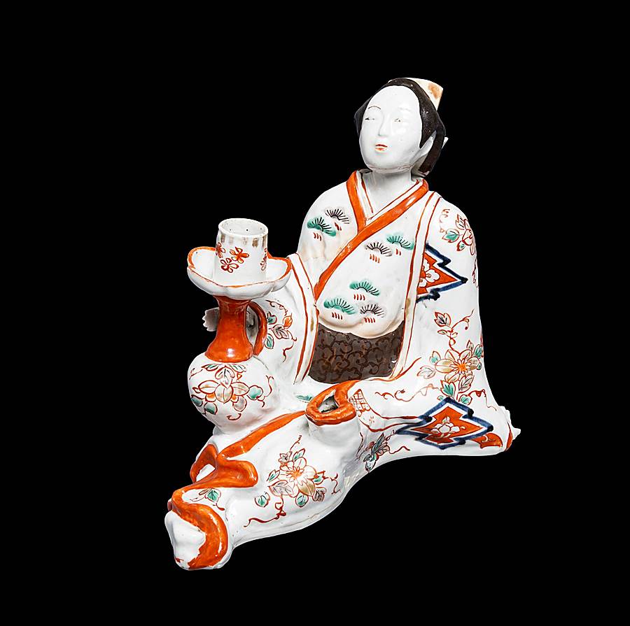Japanese arita porcelain candlestick modelled as a seated bijin